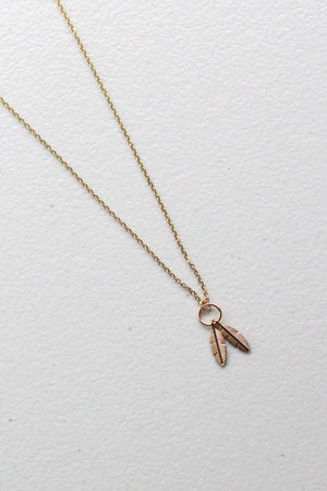 
            
                Load image into Gallery viewer, Takirua Huia – Twin Feather Necklace in Gold
            
        